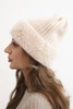 Women's winter hat made of fluffy knit with an elegant button light powder pink