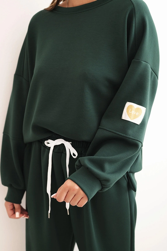 Women's set with a loose sweatshirt and pants with the word LOVE dark green