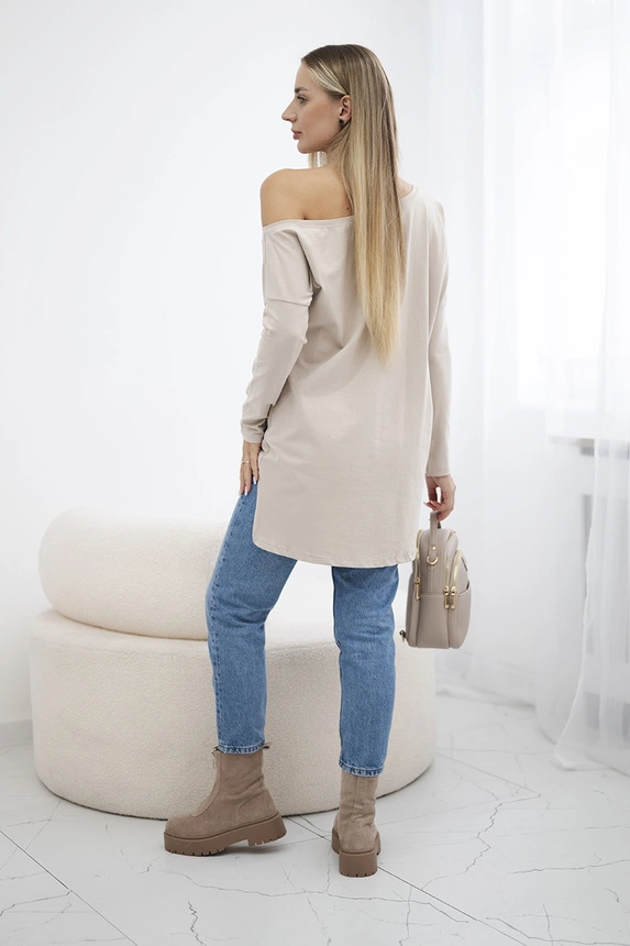Bluse mit Druck und längerem Rücken beige