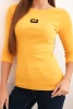 Women's ribbed blouse with 3/4 sleeves and decorative patch mustard