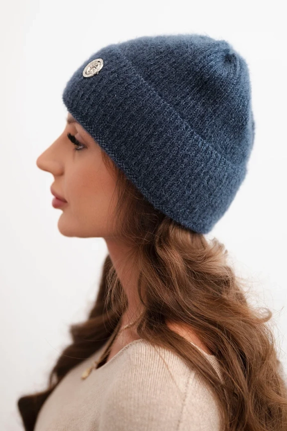 Women's winter fluffy hat with a decorative button denim color