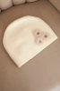Women's cap with decorative fur flowers elegant ecru