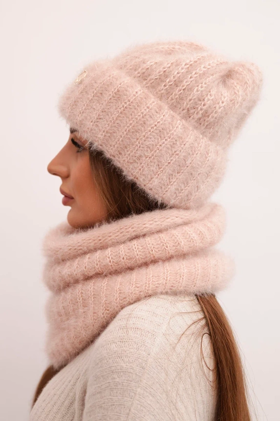 Women's set hat and winter fluffy snood with decorative emblem light powder pink