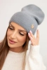 Women's soft hat made of fluffy knit with a decorative plate gray