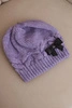 Women's winter hat with decorative bow and braid pattern K438 light purple