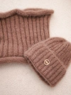 A set women's hat and snood made of knitwear fango