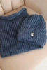 Women's set hat and winter fluffy scarf with decorative emblem denim color