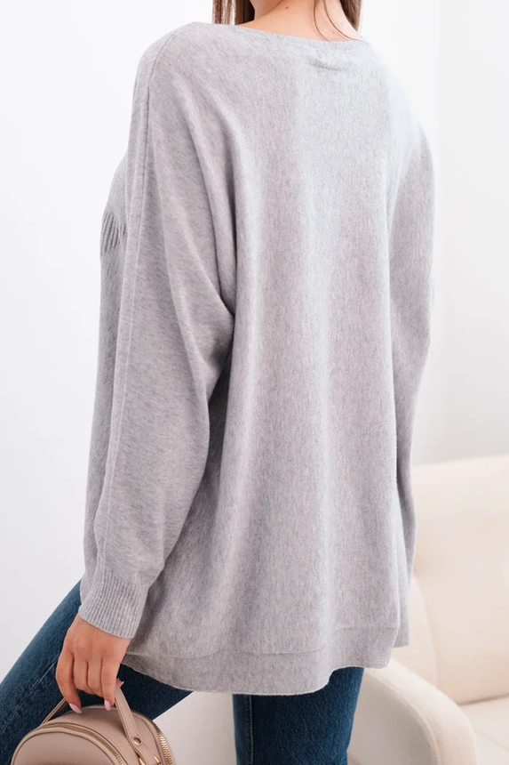 Women's sweater with a longer back and embossed star gray