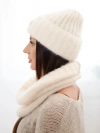 A set women's hat and snood made of knitwear light beige