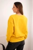 Basic women's looped cotton sweatshirt with a round neckline mustard