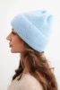 Women's winter fluffy hat with decorative button blue