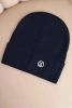 Women's ribbed cap made of modal and viscose with a decorative button navy blue
