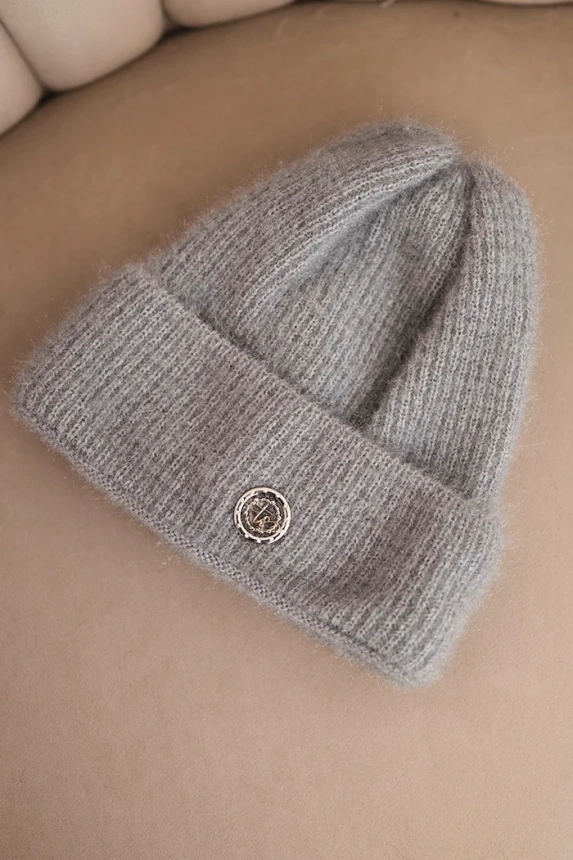 Women's winter fluffy hat with decorative button gray