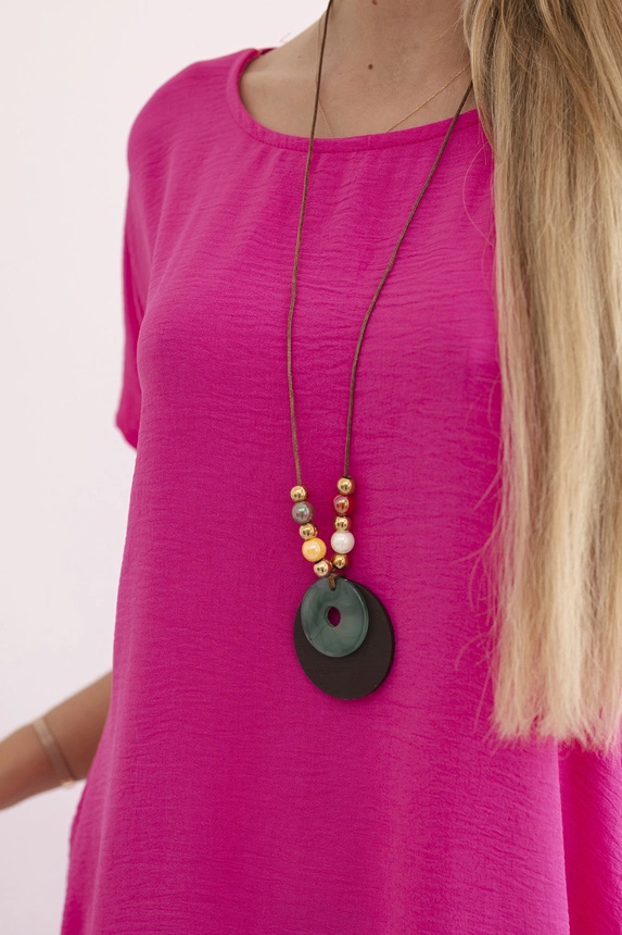 Kleid mit Taschen und Anhänger rosa