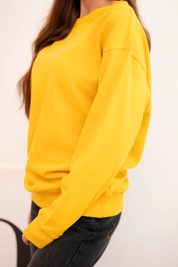 Basic women's looped cotton sweatshirt with a round neckline mustard