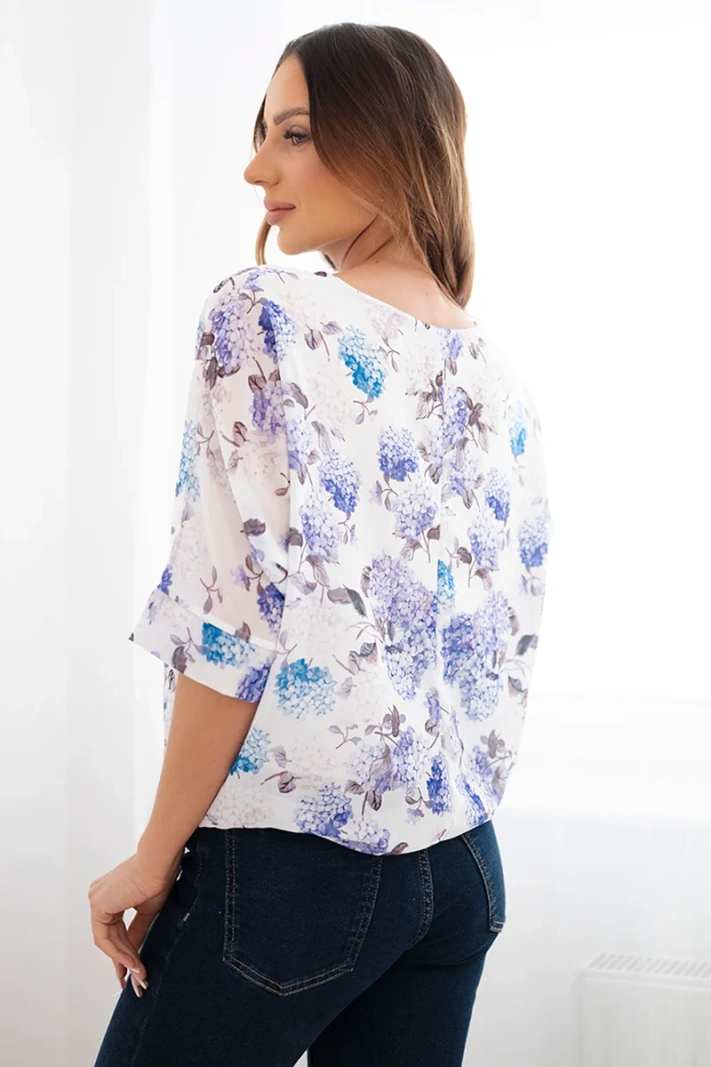 Women's floral blouse with a tie at the bottom purple
