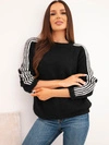 A sweater women's with wool and mohair blend with stripes on the sleeves black