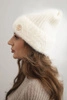 Women's winter hat made of fluffy knit with an elegant button ecru