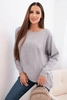 Women's sweater with a longer back and embossed star gray