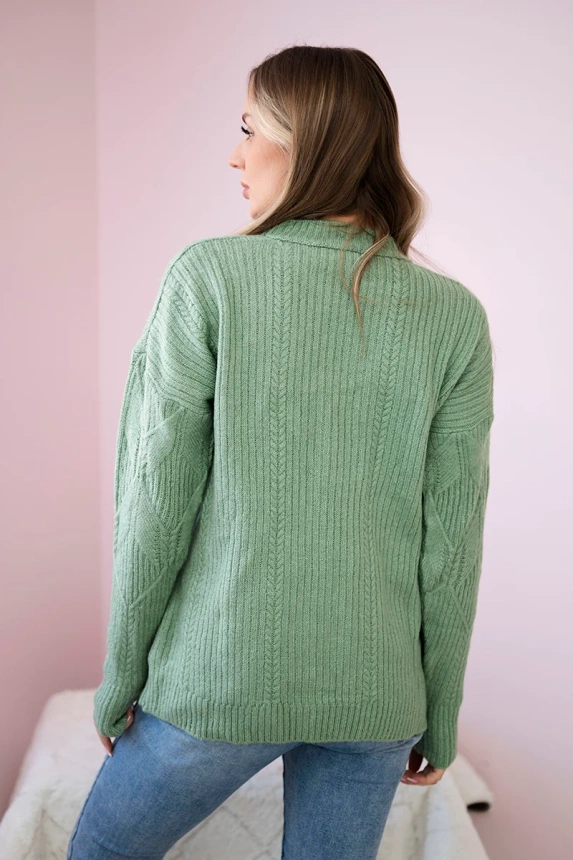 Sweater put on over the head with a fashionable weave dark mint