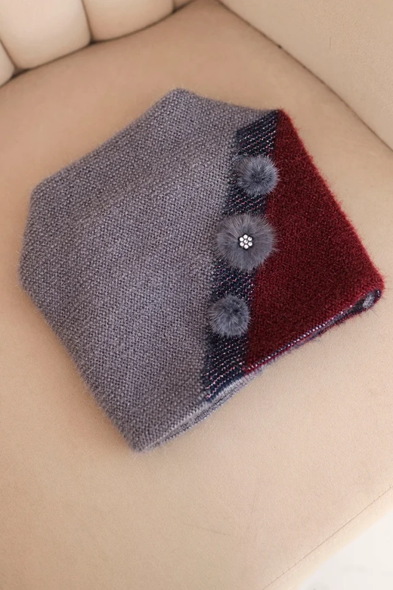 Women's elegant cap with fur decorations and a glittery band gray