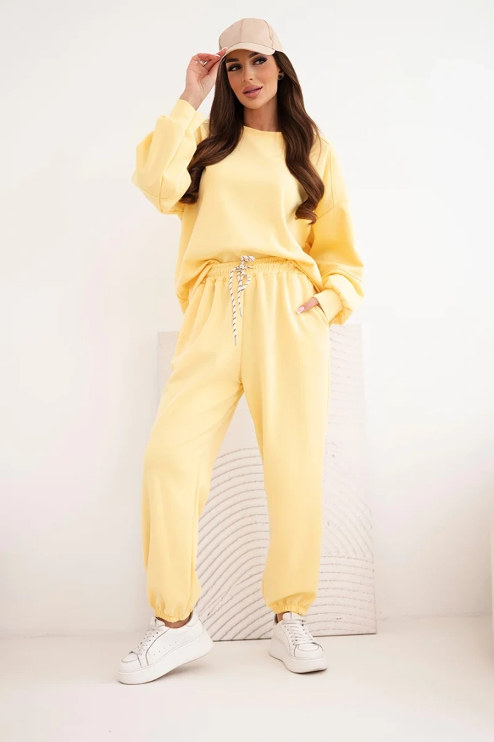 Women's butter-colored set with a loose sweatshirt and pants with the word LOVE yellow