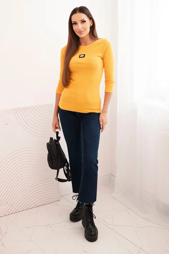 Women's ribbed blouse with 3/4 sleeves and decorative patch mustard