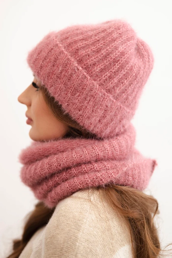 Women's set hat and winter fluffy snood with decorative emblem dark pink