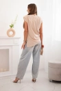 Elegant women's blouse with ruffles and asymmetrical cut beige