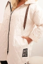 Plus Size women's quilted jacket with a hood and the inscription HOPE light beige