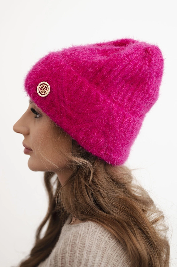 Women's winter hat made of fluffy knit with an elegant button fuchsia